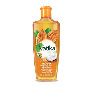 Vatika Naturals Dabur Hair Oil almond bottle for healthy shine from root to tip.