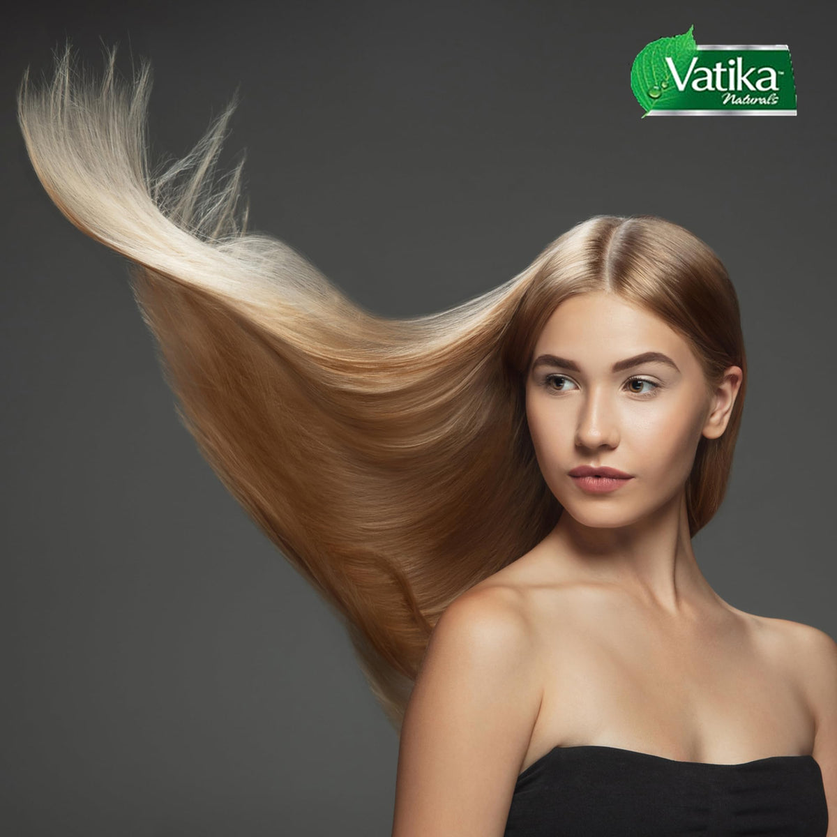 Spoon scooping Vatika Naturals Garlic Hair Mask for application
