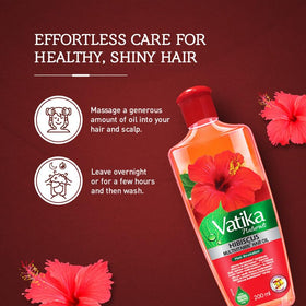 Vatika Naturals Multivitamin Hair Oil texture application shows smooth flow for even coverage.