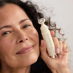 VEGAMOUR GRO+ applicator in action delivering cooling massage to the scalp.