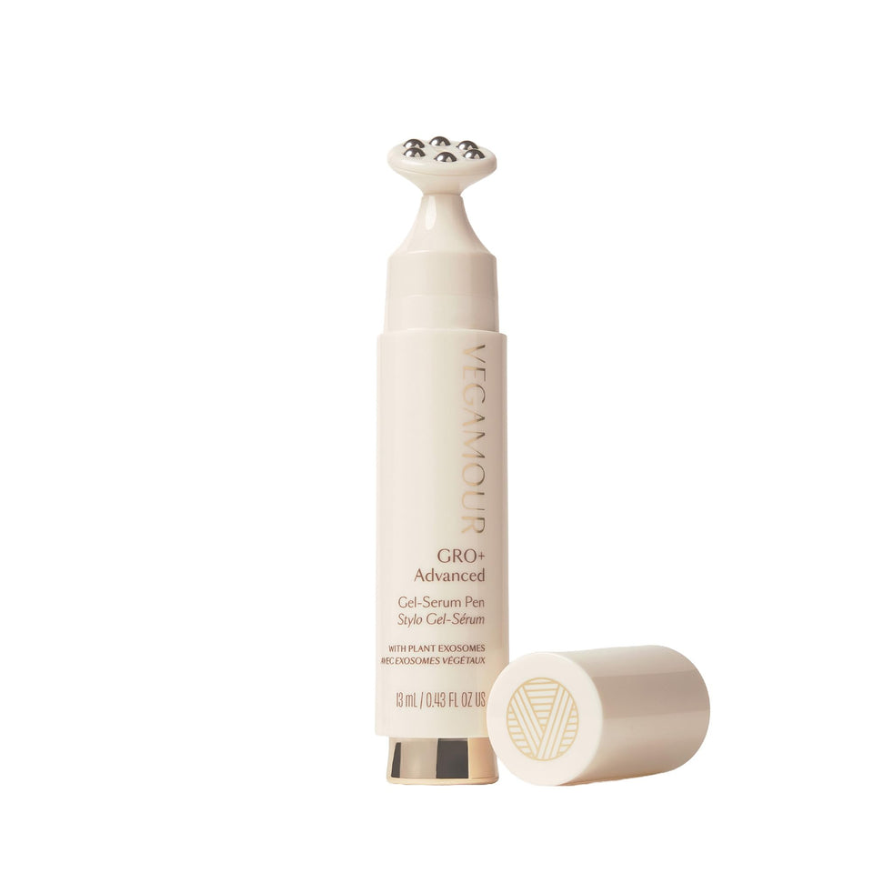 VEGAMOUR GRO+ bottle close-up showing cooling gel-serum texture for scalp care.