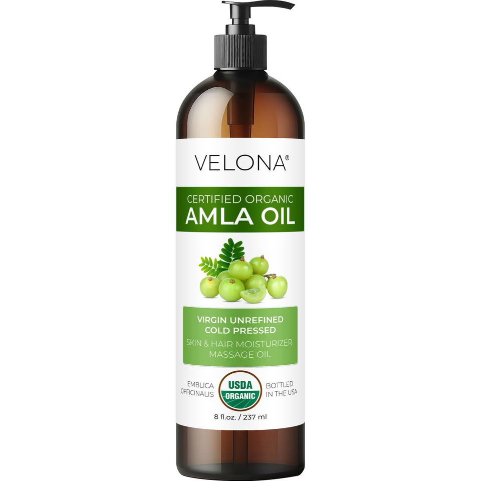 Velona Amla Oil bottle pour demonstrates pure oil ideal for deep hair hydration