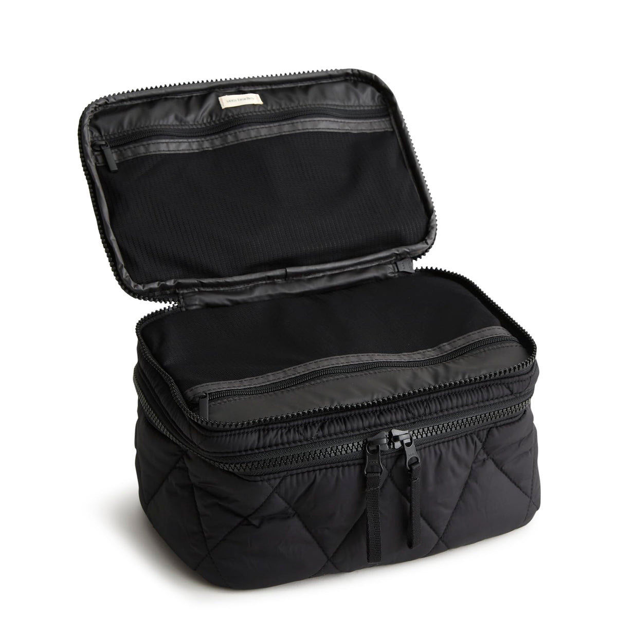 Vera Bradley Brush Up case interior showing pockets and brush holders for organized makeup.