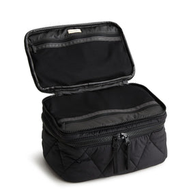 Vera Bradley Brush Up case interior showing pockets and brush holders for organized makeup.