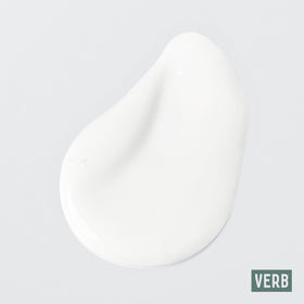 Applying VERB Curl Conditioner to waves to ease detangling and reduce frizz