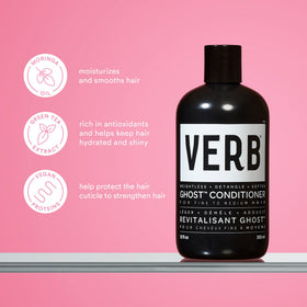 VERB Ghost Shampoo bottle shown during a gentle scalp massage for cleansing
