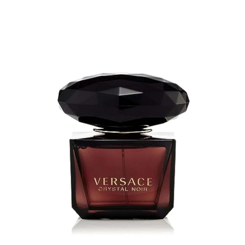 Versace Crystal Noir bottle closeup showcases elegant design for a luxe evening.