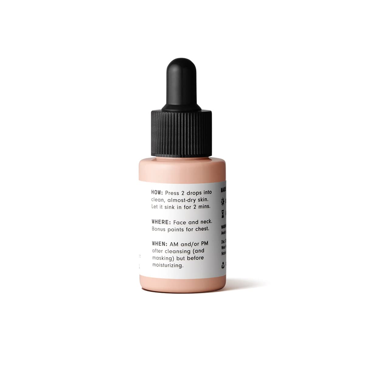 Versed serum dropper releasing precise drops for application.