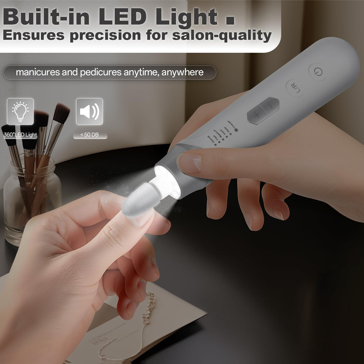VFD cordless nail drill in hand demonstrates ergonomic, portable design for at-home manicures.