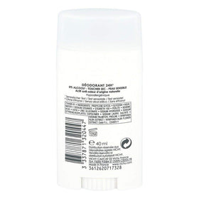 Vichy aluminum-free deodorant stick being applied on clean underarms for sensitive-skin protection.
