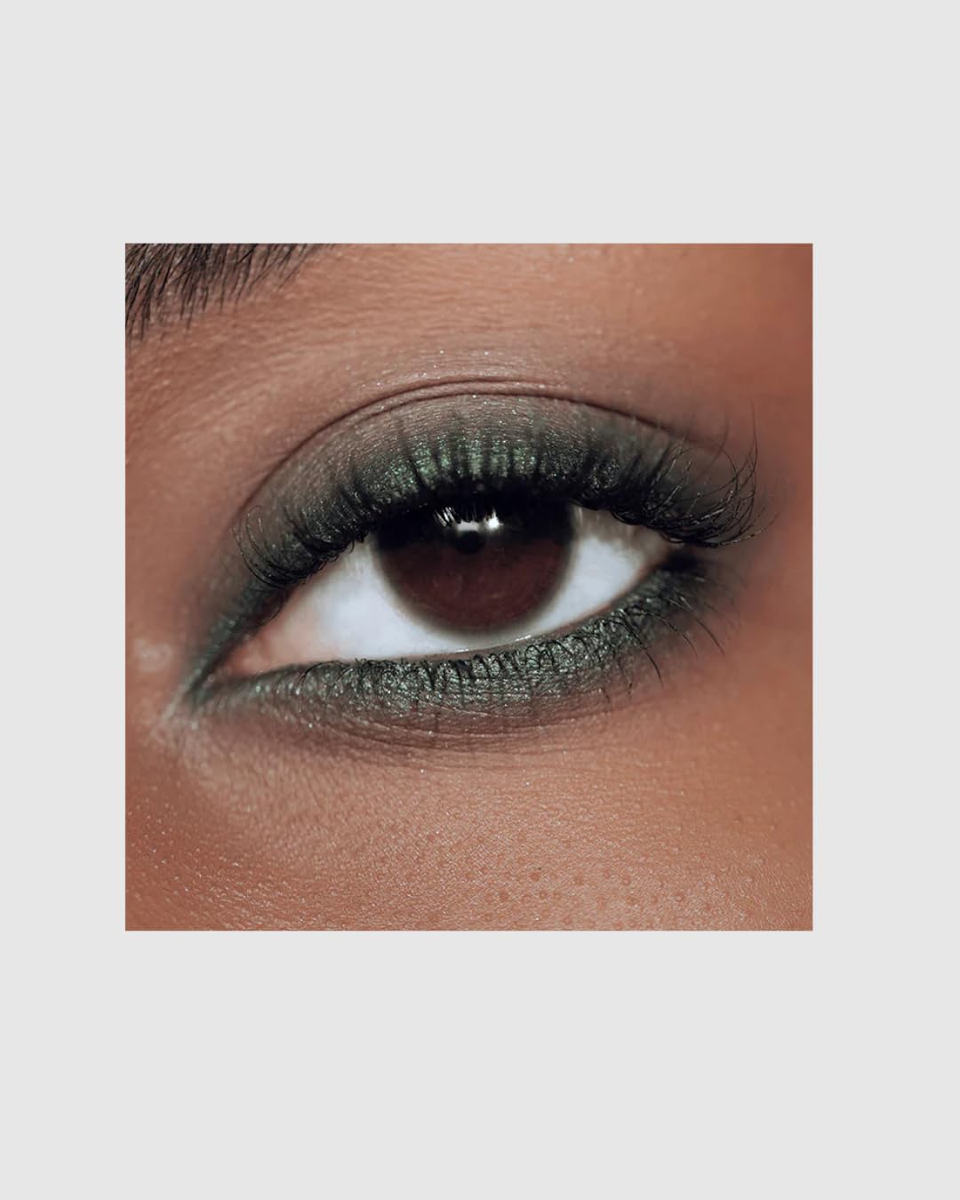 Close-up of Victoria Beckham Satin Kajal Eyeliner Olive highlighting creamy glide for easy application.