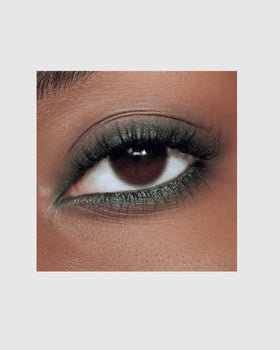 Close-up of Victoria Beckham Satin Kajal Eyeliner Olive highlighting creamy glide for easy application.
