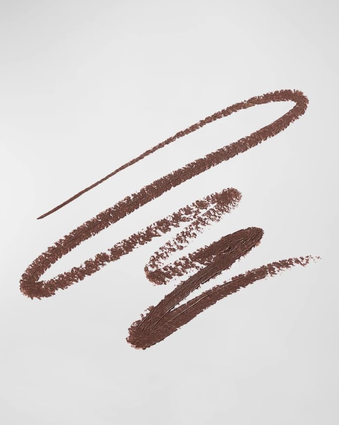 Victoria Beckham Satin Kajal Cocoa being applied along the lash line for precise definition.