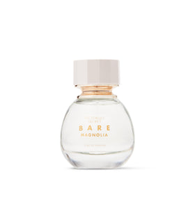 Bare Magnolia spray captured mid-mist for quick, subtle refresh
