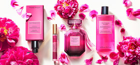 Victoria's Secret Bombshell Passion gift set display with fragrance and accessories.