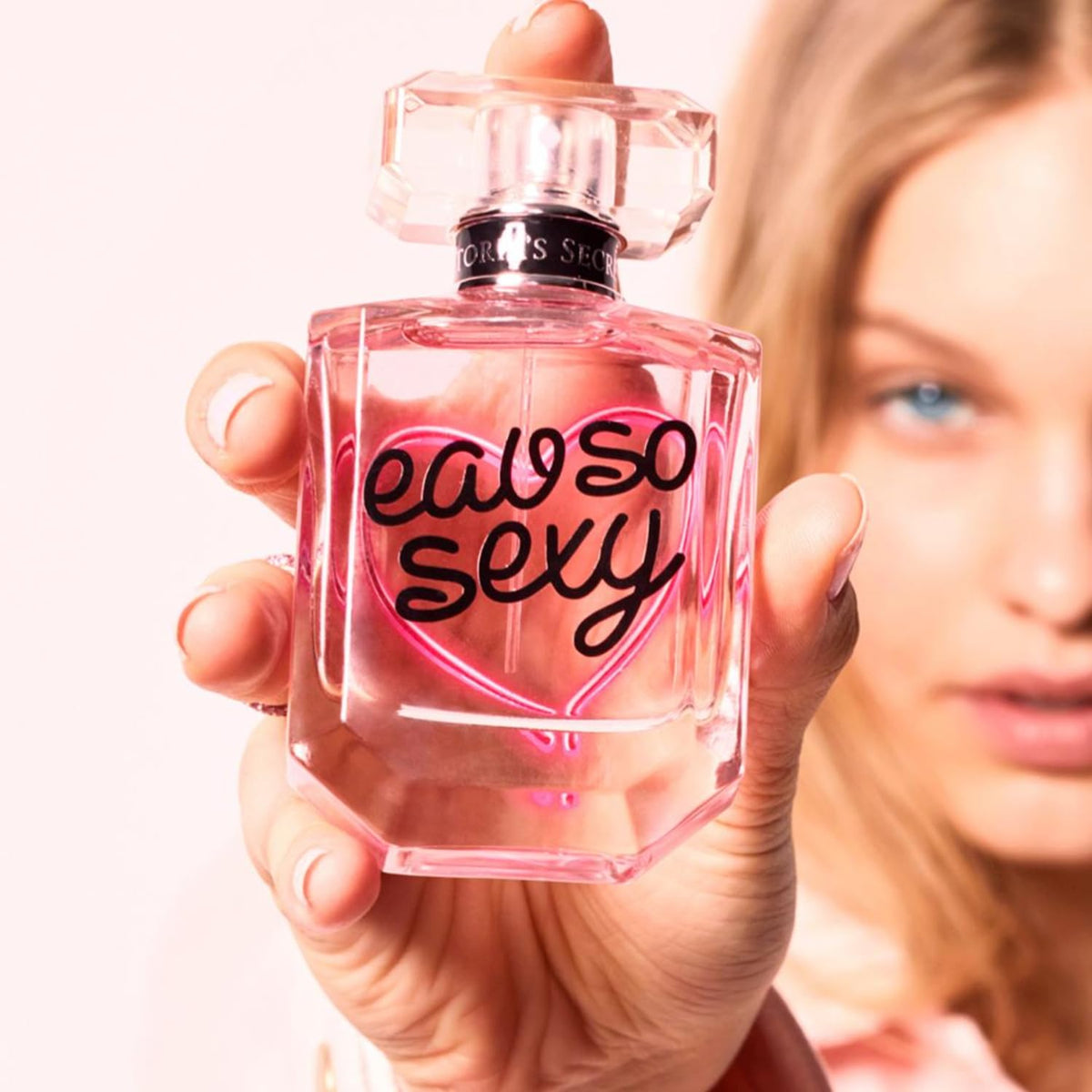 Victoria's Secret Eau So Sexy bottle pour reveals smooth flow and generous 3.4 oz size.