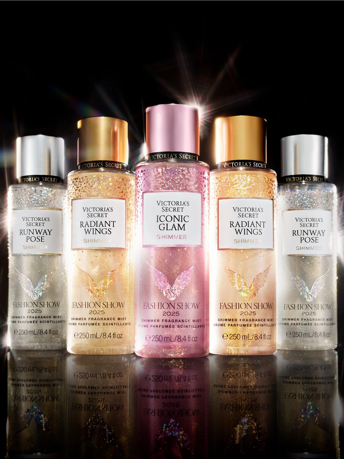 Victoria's Secret Fashion Show vibe as model walks with shimmer mist on skin