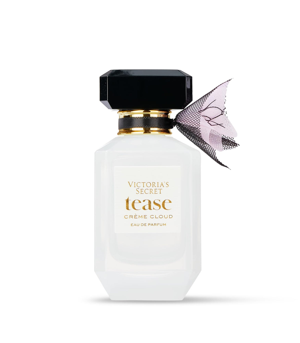 Victoria's Secret Tease Creme Cloud bottle with amber glow emphasizing sheer warmth.