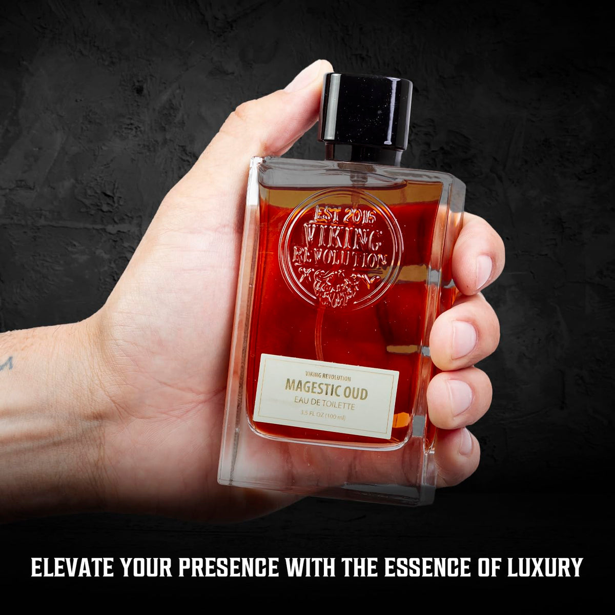Side view of Viking Revolution Majestic Oud bottle highlighting its rich reddish-brown hue