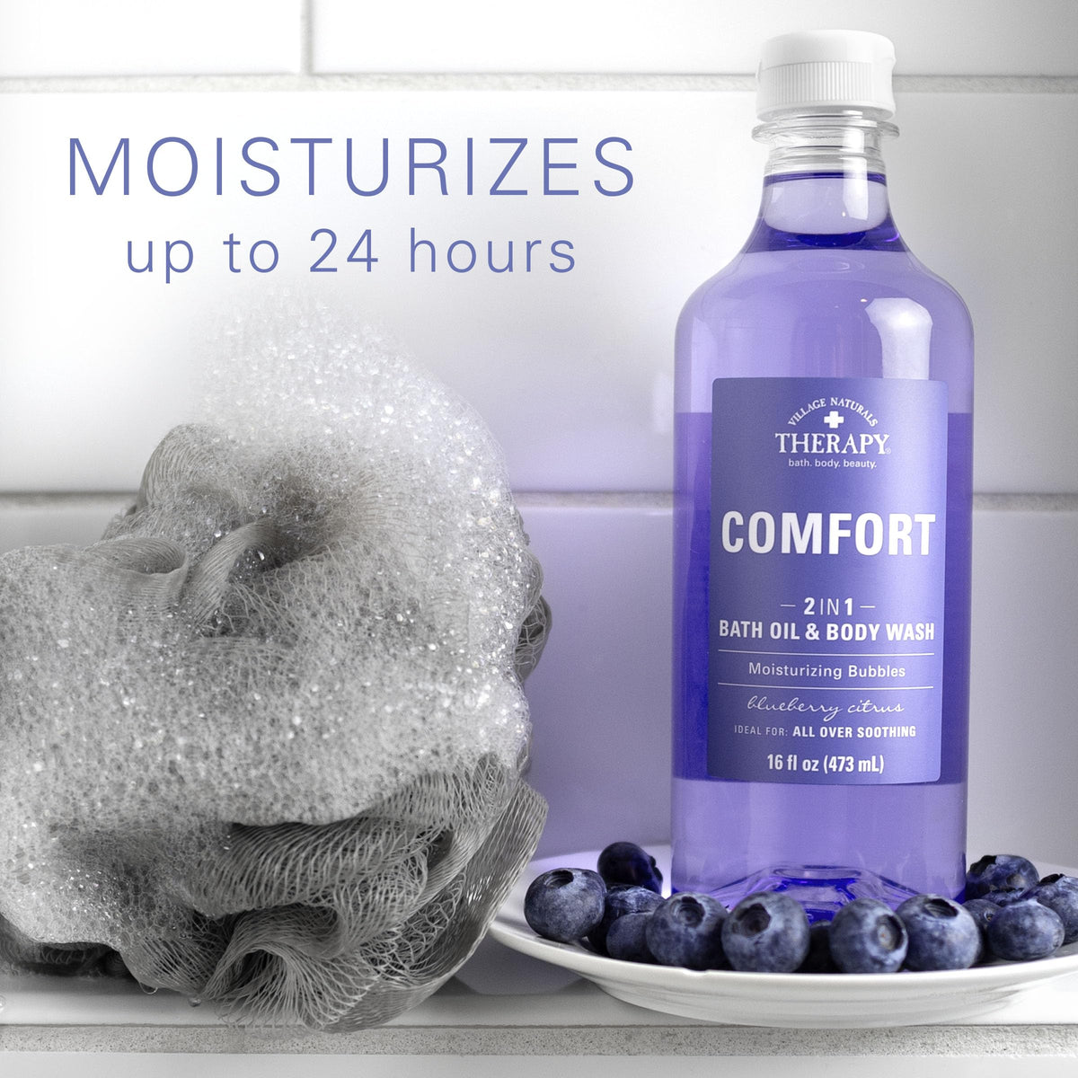 Village Naturals Therapy Comfort bath oil in tub with foaming bubbles and a soothing soak
