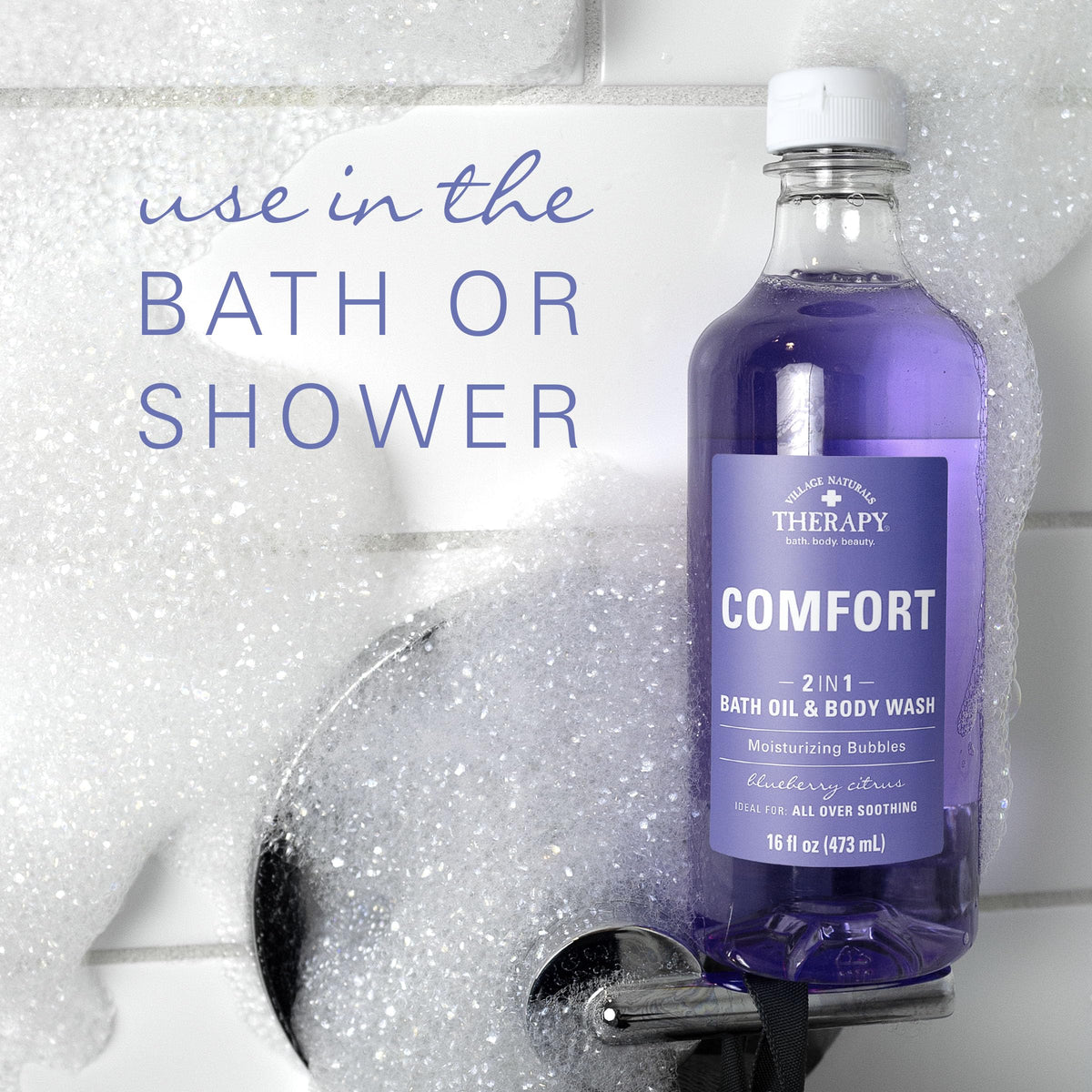 Village Naturals Therapy Comfort bath oil ingredient visual highlighting arnica and epsom salt