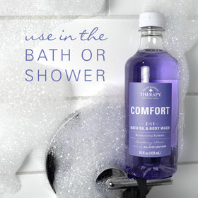 Village Naturals Therapy Comfort bath oil ingredient visual highlighting arnica and epsom salt