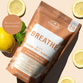 Village Naturals Therapy Breathe packaging highlights Epsom salt and essential oils.