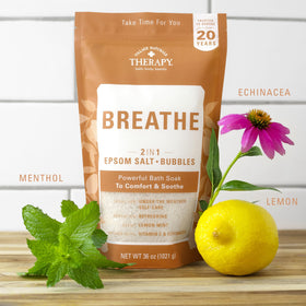 Village Naturals Therapy Breathe essential oils bottle suggesting citrus-mint refreshment.
