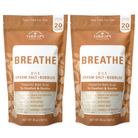 Village Naturals Therapy Breathe foaming body soak bottle with lemon-menthol aroma for relaxation.