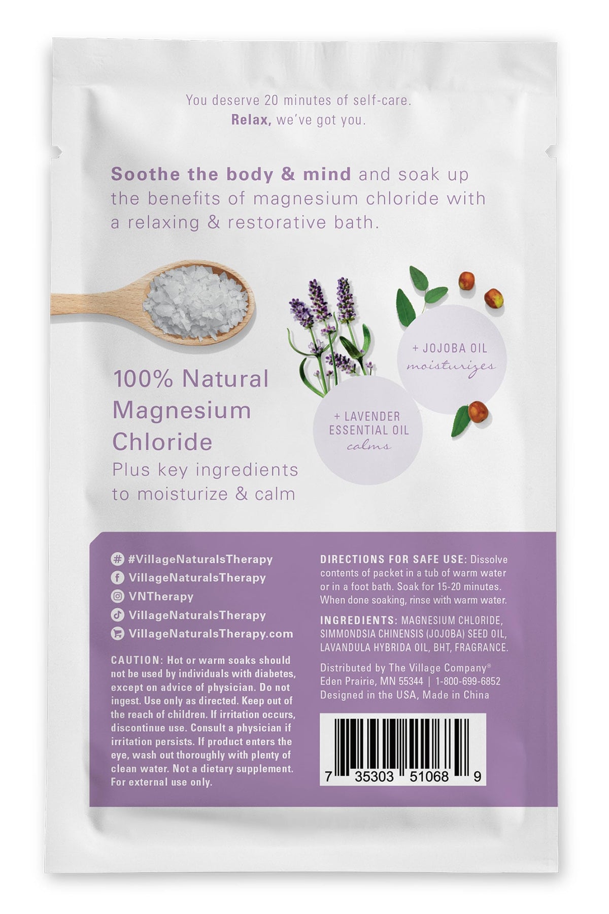 Village Naturals Therapy Calm Magnesium Bath Flakes close-up of mineral crystals.