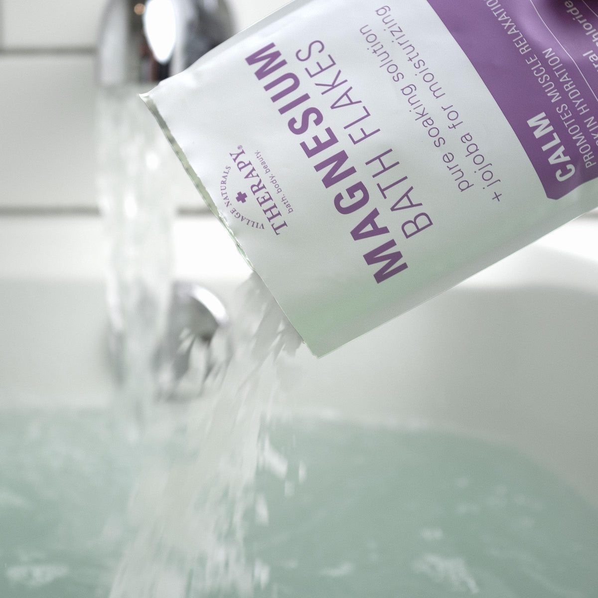 Lavender vanilla aroma with Village Naturals Therapy Calm flakes in a serene bath.