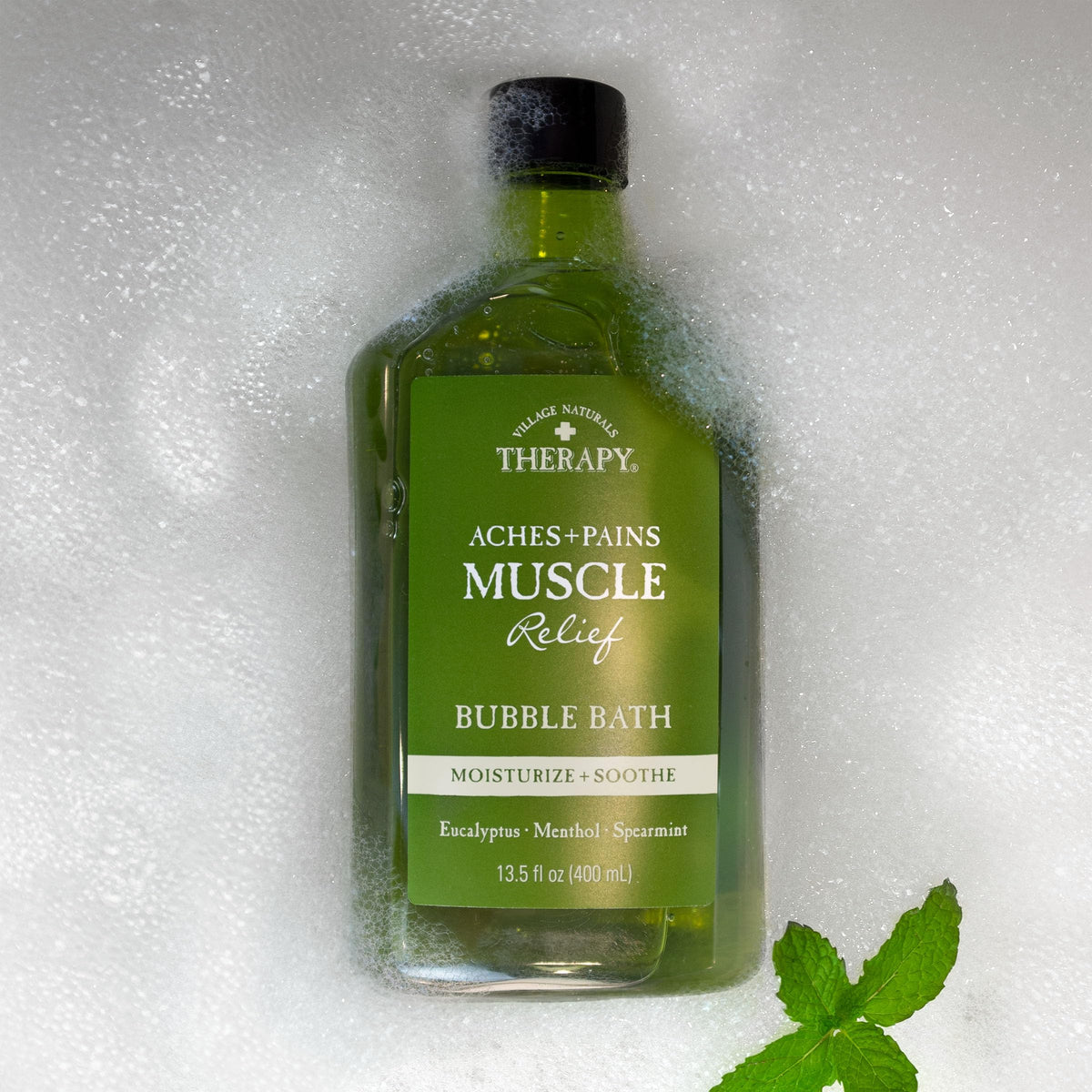 Relaxing spa setup featuring Village Naturals Therapy gift set with towels and soft lighting.