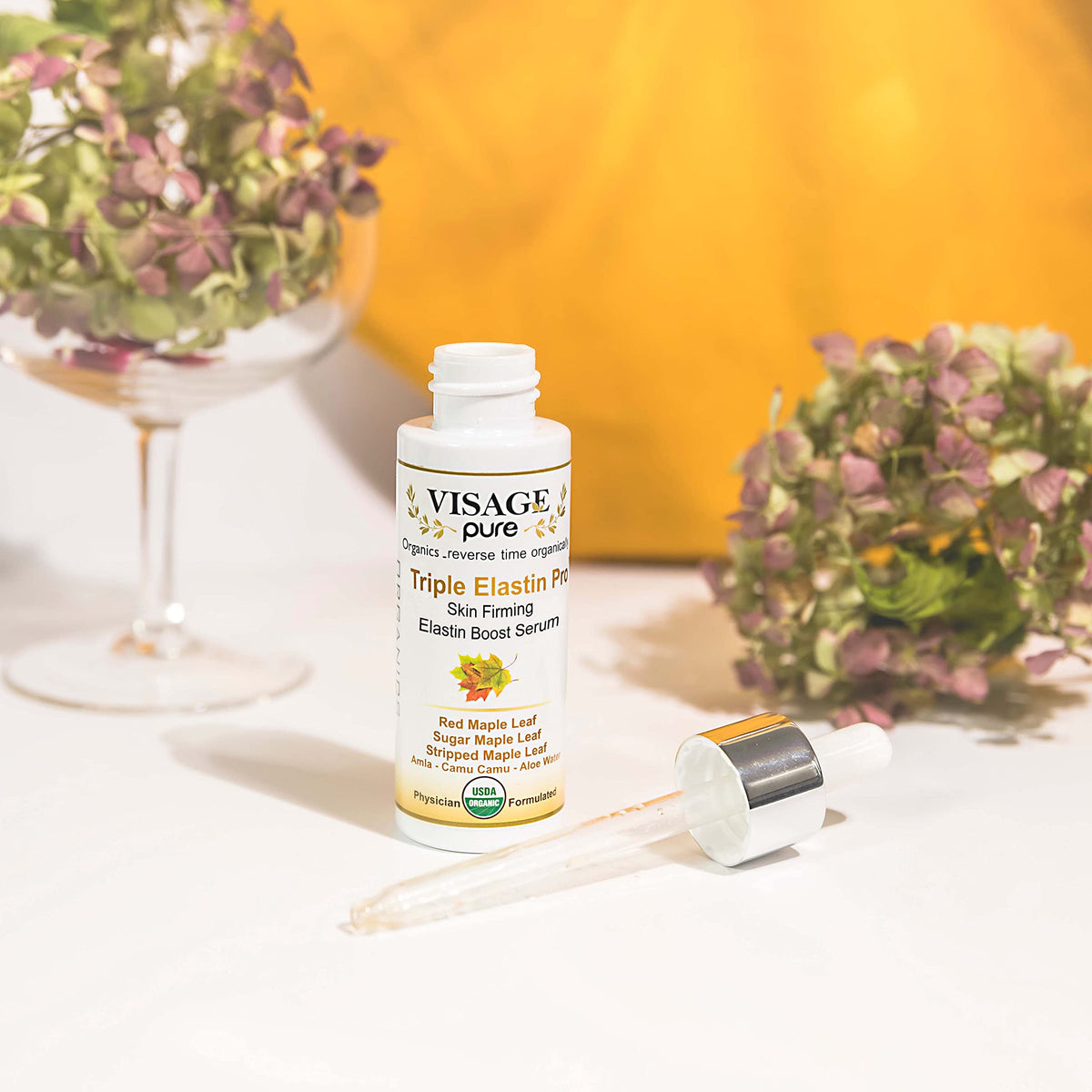 Visage Pure serum close-up bottle shines with premium quality and texture for daily care.