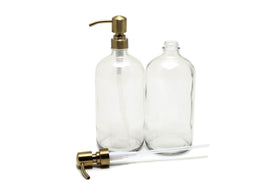 Vivaplex yellow gold stainless steel pump on a clear glass bottle for smooth dispensing.