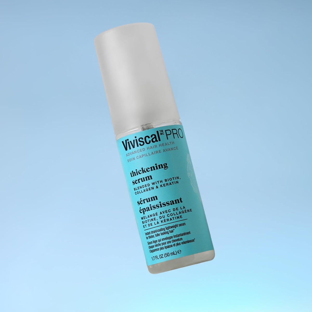 Viviscal Thin to Thick Elixir hands applying highlights quick scalp massage and absorption.