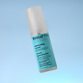Viviscal Thin to Thick Elixir hands applying highlights quick scalp massage and absorption.