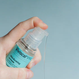 Viviscal Thin to Thick Elixir serum texture shows a non-greasy finish for daily use.