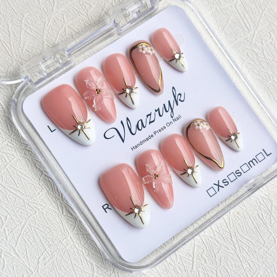 Vlazryk Brown French Tip nails with 3D metallic rhinestones for a glam look