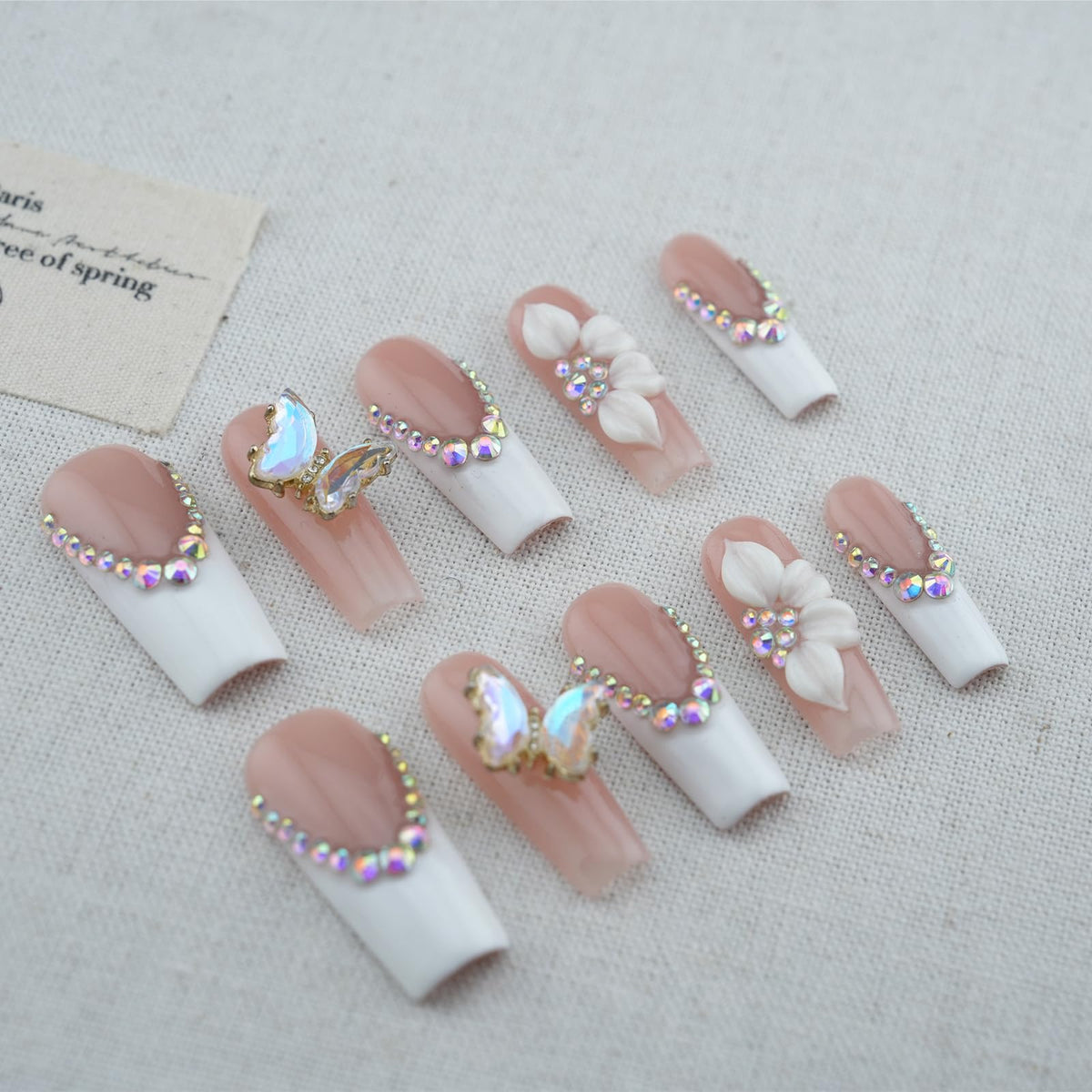 Vlazryk floral and butterfly nail art close-up highlighting unique designs and celebration-ready style.