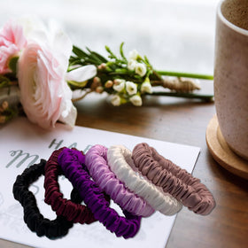 VLOMOT white silk scrunchies keep hair neat and frizz-free during workouts.