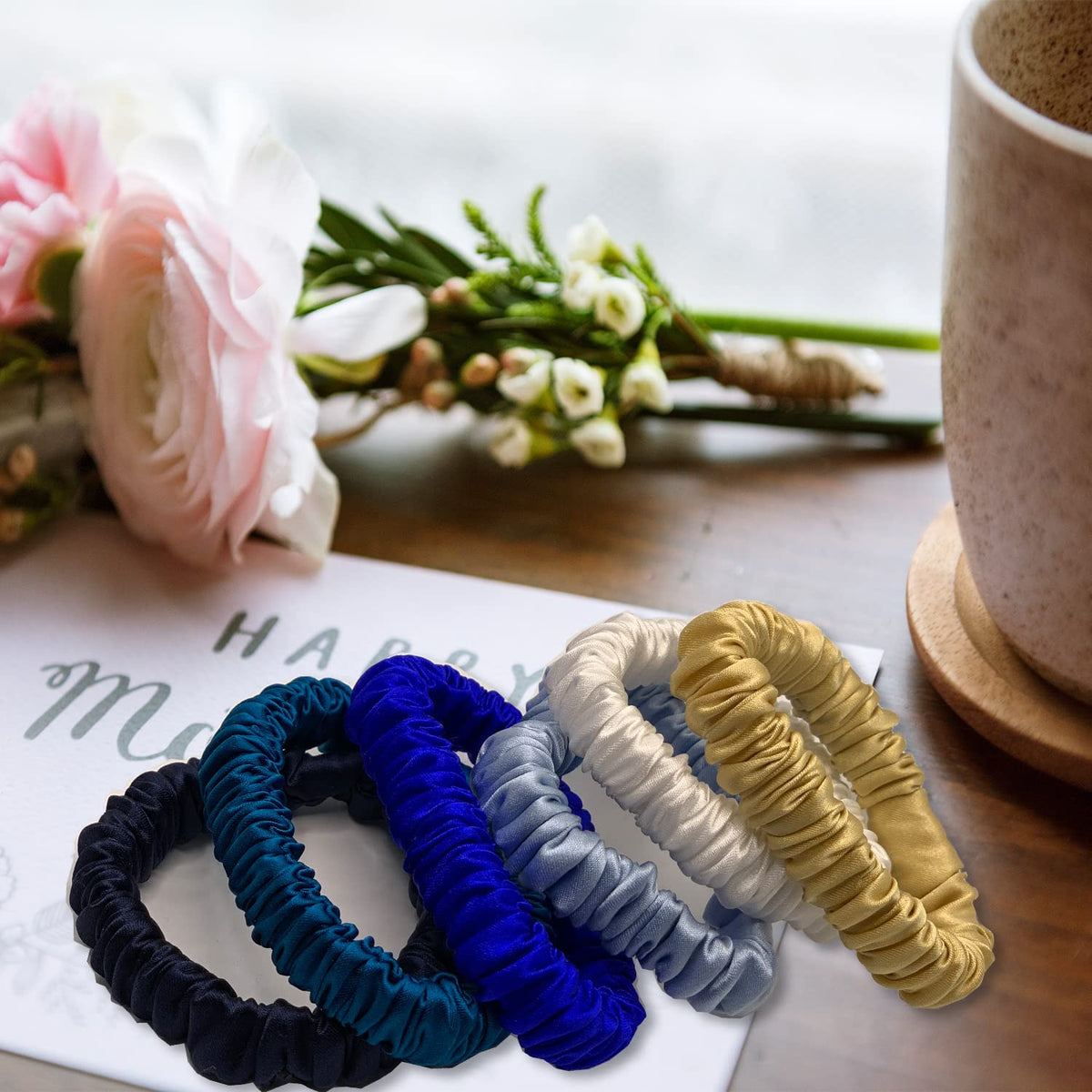 VLOMOT mulberry silk scrunchie in gold adds polish and comfortable control for workouts.
