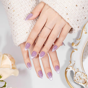 VSALON almond press-on nails pastel purple ombre on a manicure setup