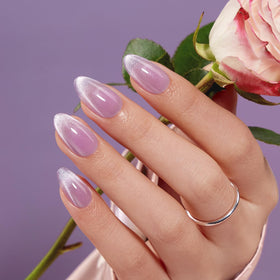 VSALON almond press-on nails in pastel light purple ombre on hand for at home manicure