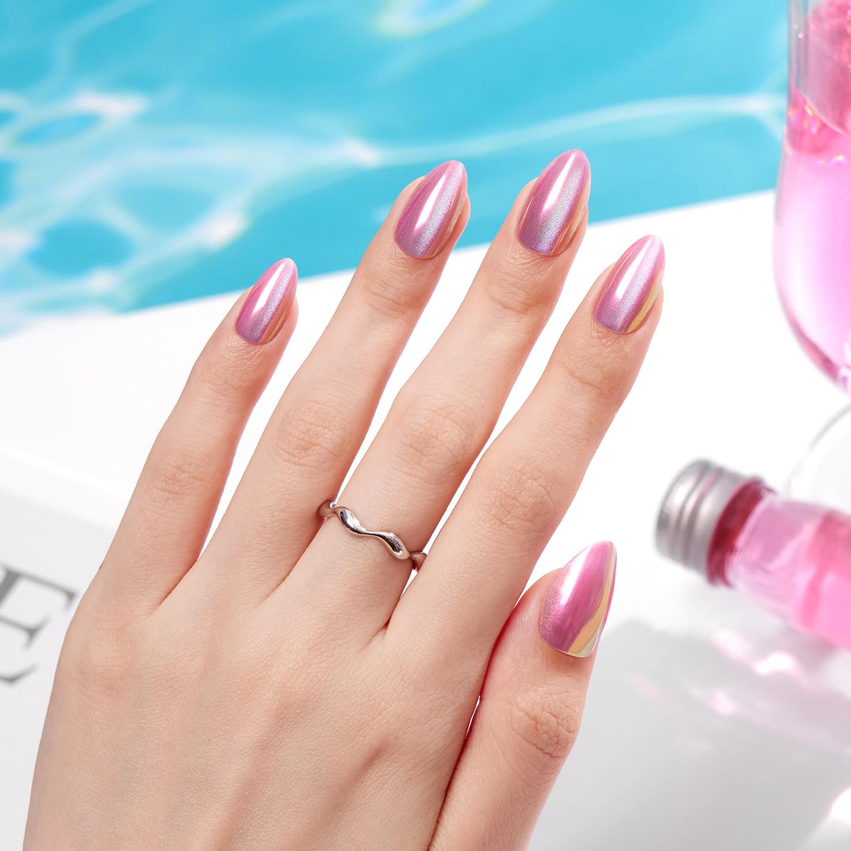 VSALON Pink chrome aurora nails showing shifting colors under light