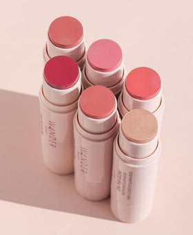 Wander Beauty glow on shoulders and décolletage for subtle body radiance.