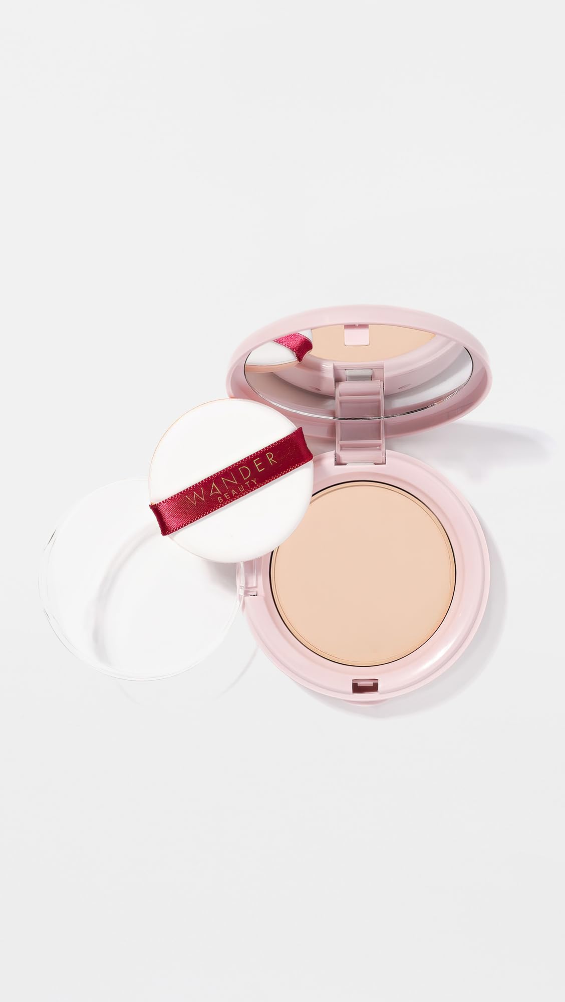 Wander Beauty Wanderlust Powder Foundation compact in use, easy blending and buildable coverage.