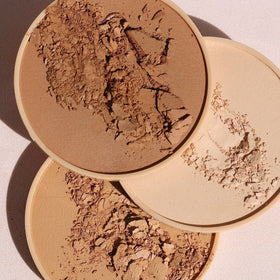 Wander Beauty Wanderlust Powder Foundation brush application for quick touch-ups.