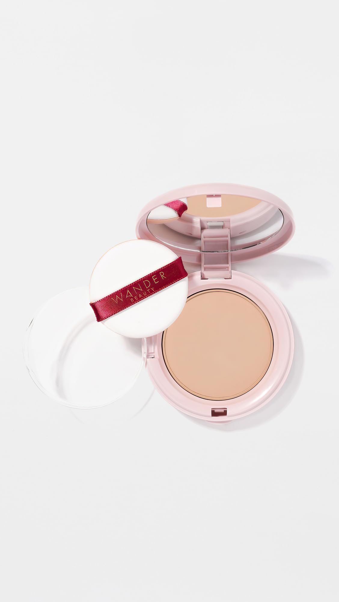 Wander Beauty Wanderlust Powder Foundation light-medium swatch in warm undertones blends naturally.