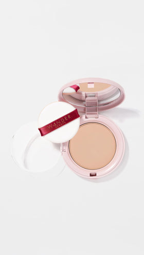 Wander Beauty Wanderlust Powder Foundation light-medium swatch in warm undertones blends naturally.