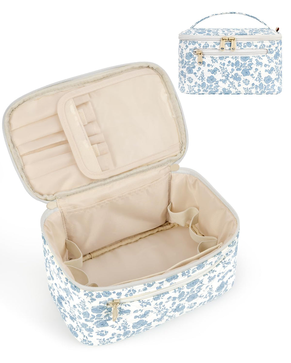 Wandering Nature makeup bag with quilted blue florals and front pocket for quick access.